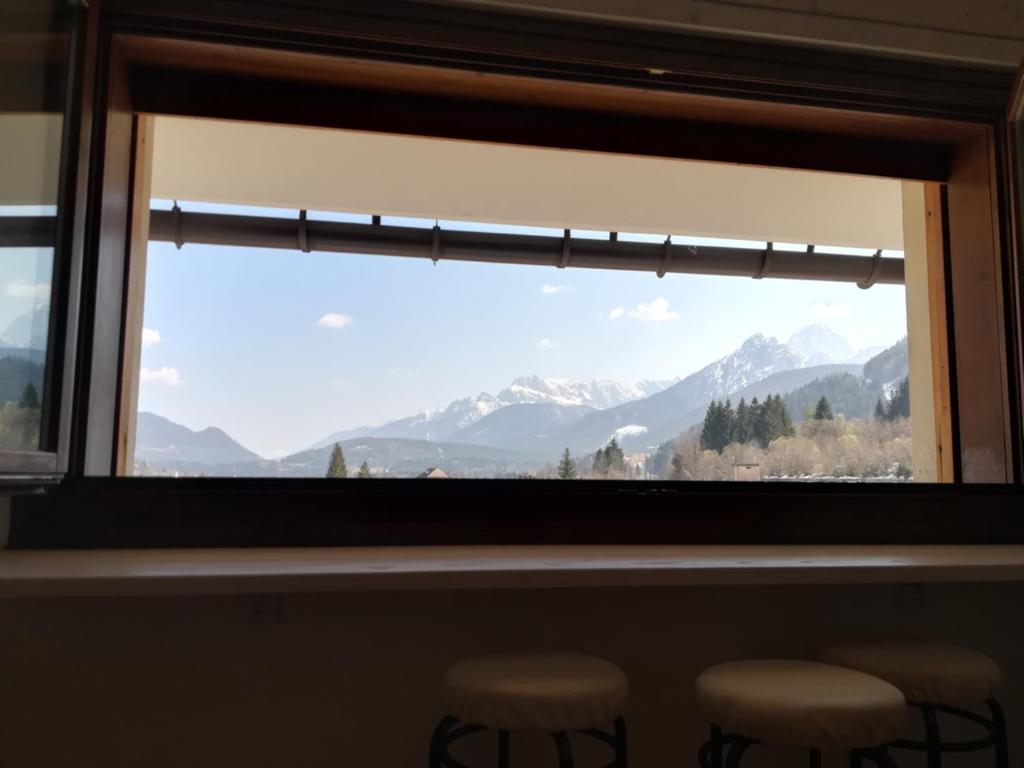 a window with a view of mountains at appartamento Florianca in Tarvisio