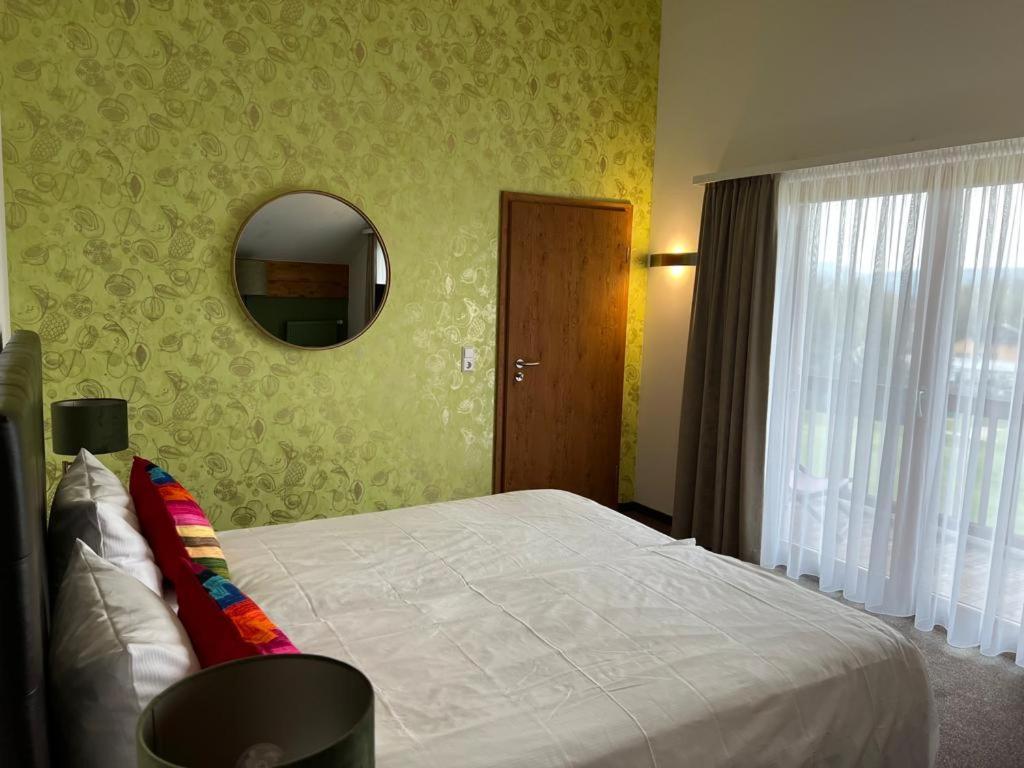 Postel nebo postele na pokoji v ubytování Sapia Hotel Rheinsberg