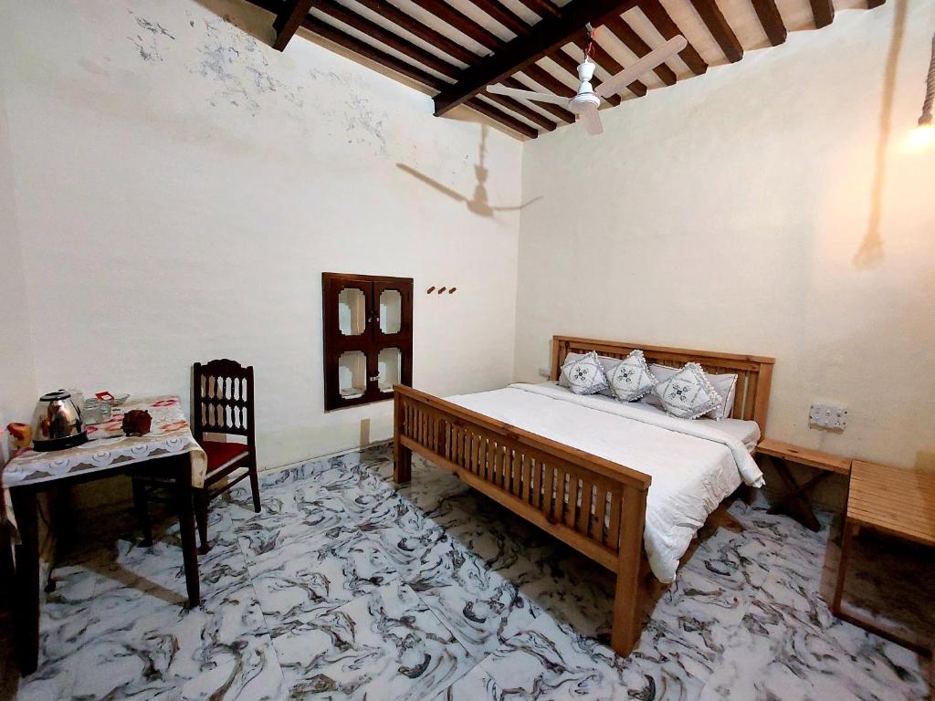 Postelja oz. postelje v sobi nastanitve Virasat E Punjab -Farmstay Amritsar