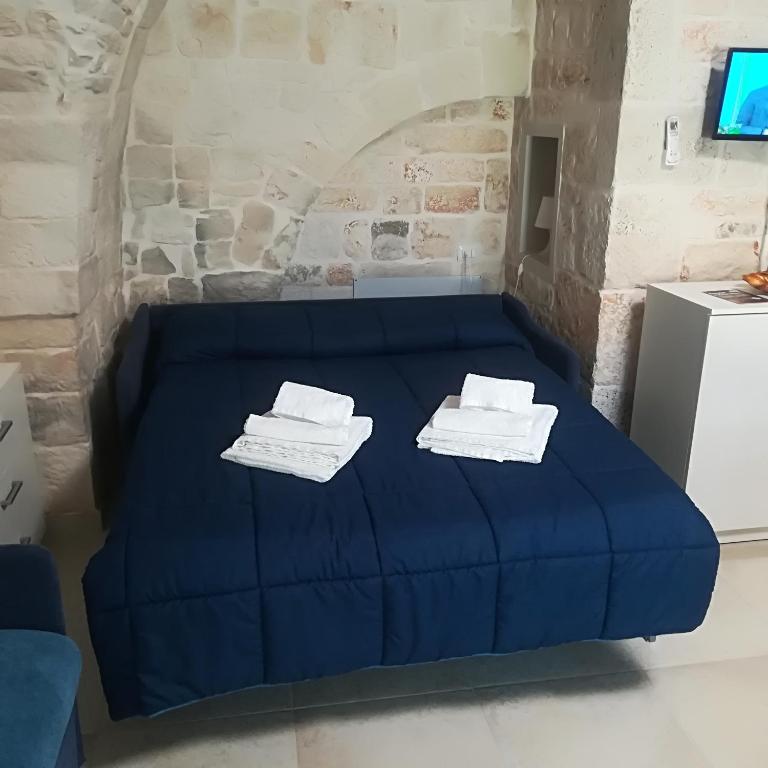 Postel nebo postele na pokoji v ubytování Trulli Manuela 2