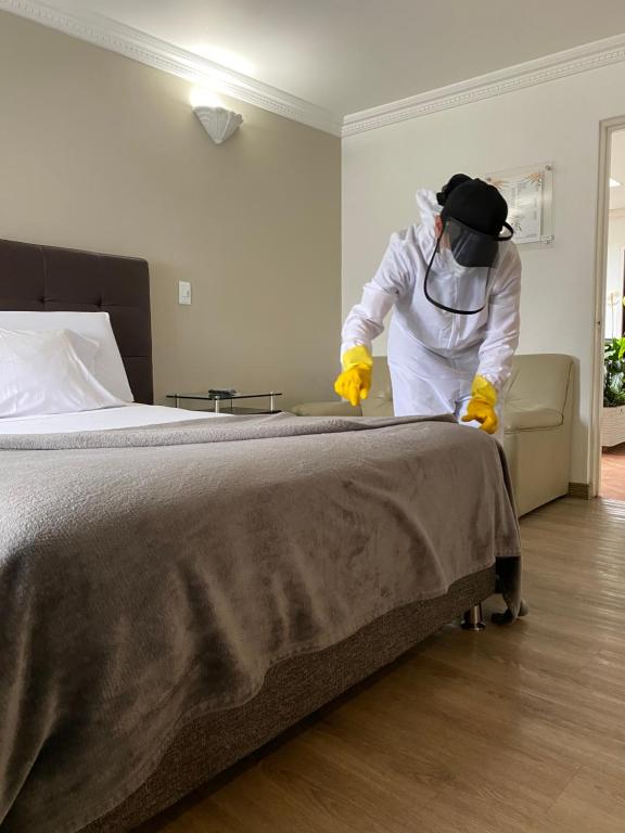 Postel nebo postele na pokoji v ubytování Hotel Picasso Inn