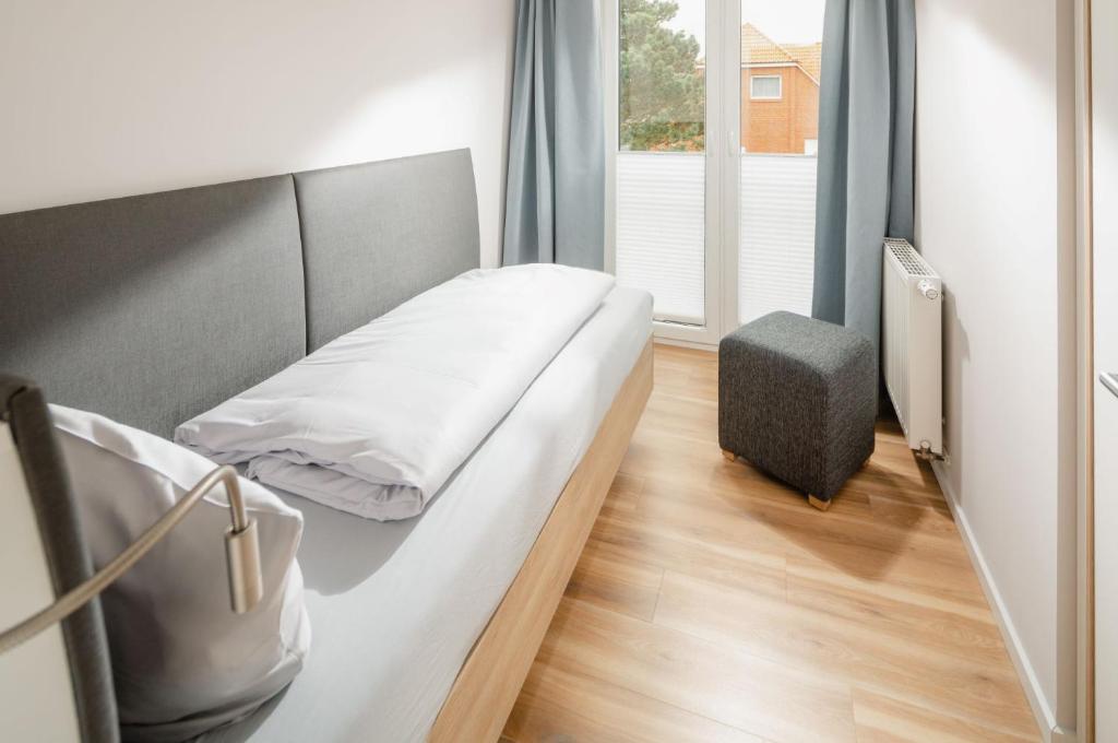 Postel nebo postele na pokoji v ubytování Apartmenthaus B3