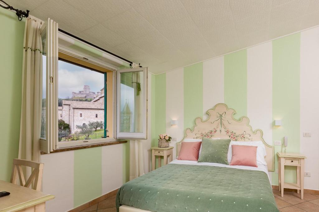 Postel nebo postele na pokoji v ubytování Hotel Ideale