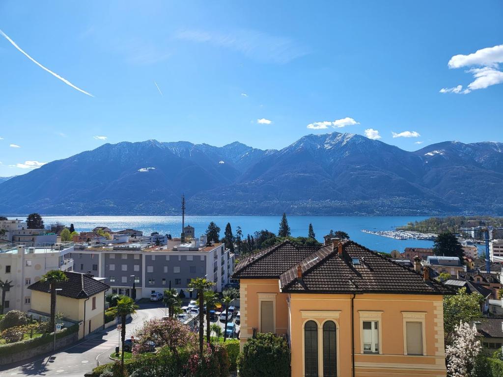 a view of a city with mountains in the background at Ferienwohnung Montana Lago in Locarno