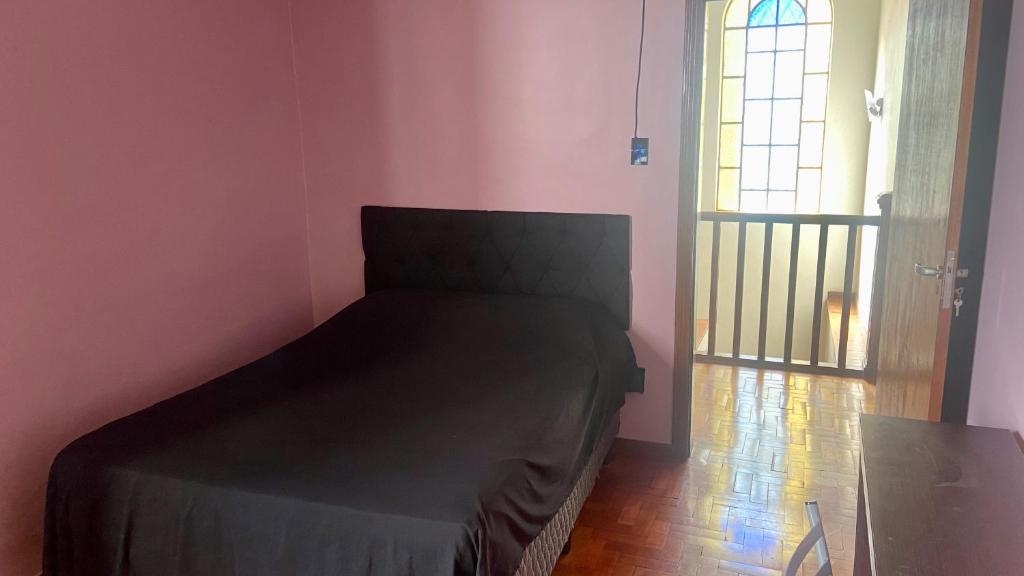 Cama ou camas em um quarto em Vila Santê