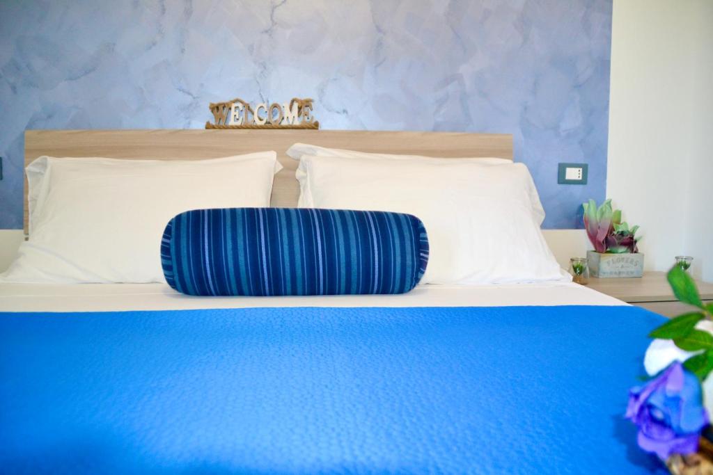 Postel nebo postele na pokoji v ubytování Sperlonga Paradise Suites 500m dal mare in estate Servizio navetta per Sperlonga centro