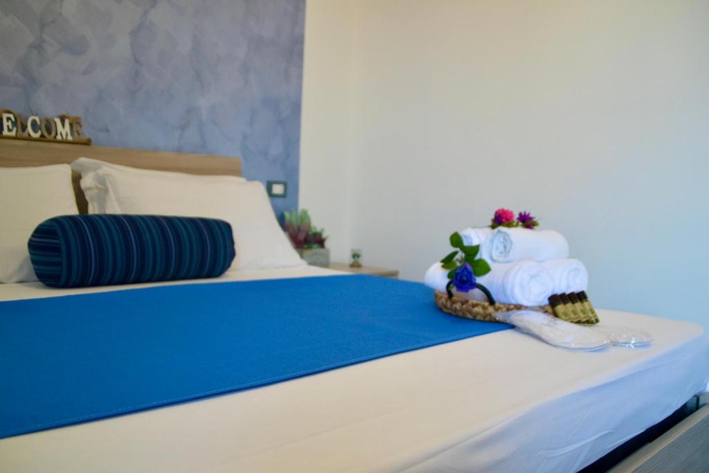 Postel nebo postele na pokoji v ubytování Sperlonga Paradise Suites 500m dal mare in estate Servizio navetta per Sperlonga centro