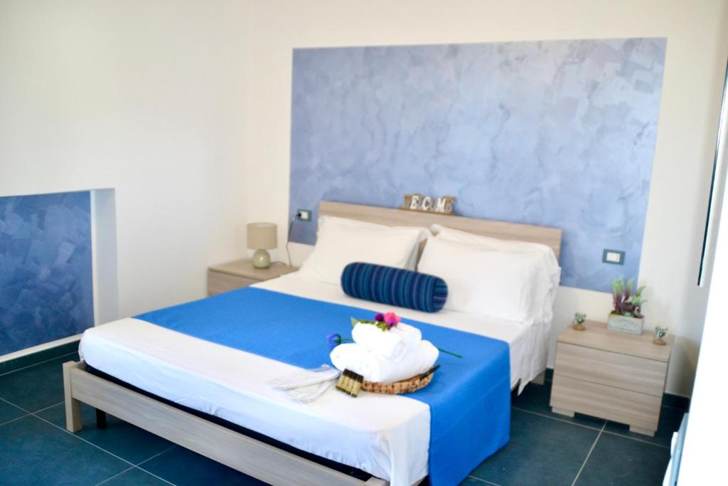 Postel nebo postele na pokoji v ubytování Sperlonga Paradise Suites 500m dal mare in estate Servizio navetta per Sperlonga centro