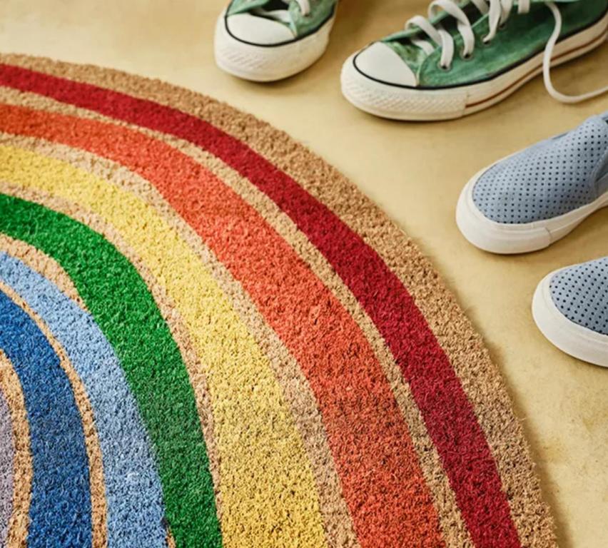 a group of shoes sitting on a colorful rug at Habitación Familiar in Madrid