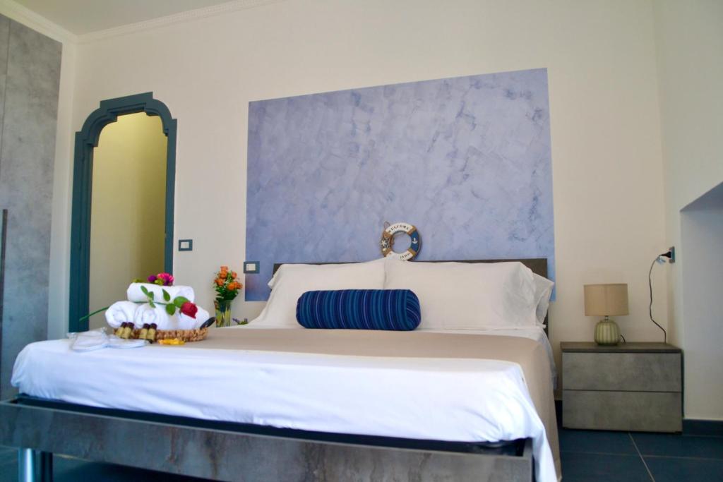 Postel nebo postele na pokoji v ubytování Sperlonga Paradise Suites 500m dal mare in estate Servizio navetta per Sperlonga centro