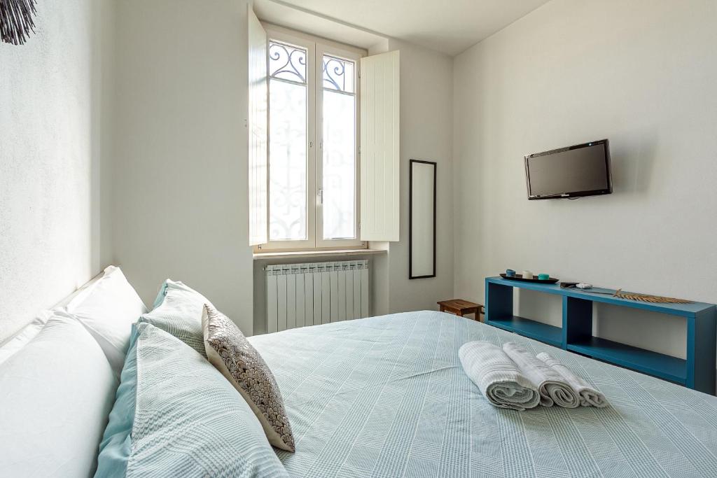 Łóżko lub łóżka w pokoju w obiekcie Al 33 di Via Roma - Apartments
