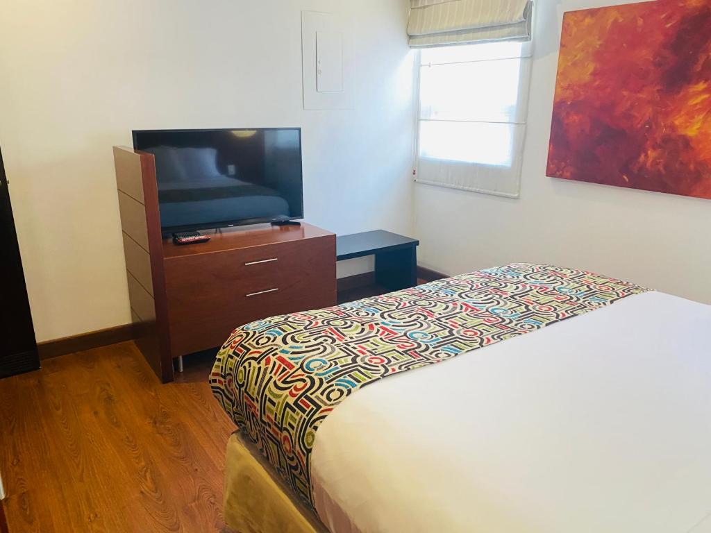 Postel nebo postele na pokoji v ubytování Hotel Retiro 84 by MIJ