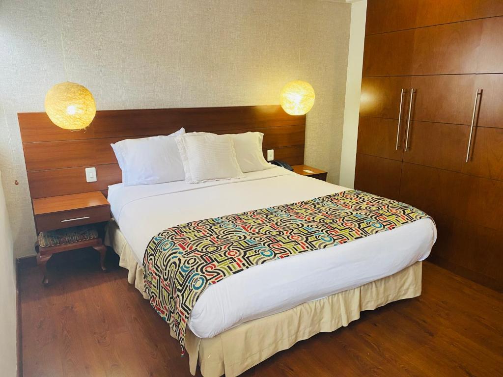 Postel nebo postele na pokoji v ubytování Hotel Retiro 84 by MIJ