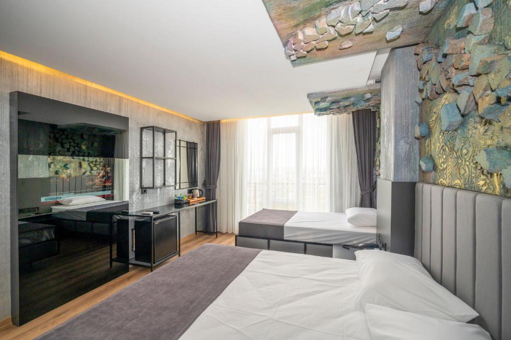Postel nebo postele na pokoji v ubytování Continental Airport Hotel