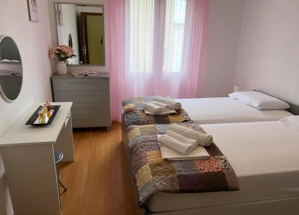Postel nebo postele na pokoji v ubytování Apartments Mihi