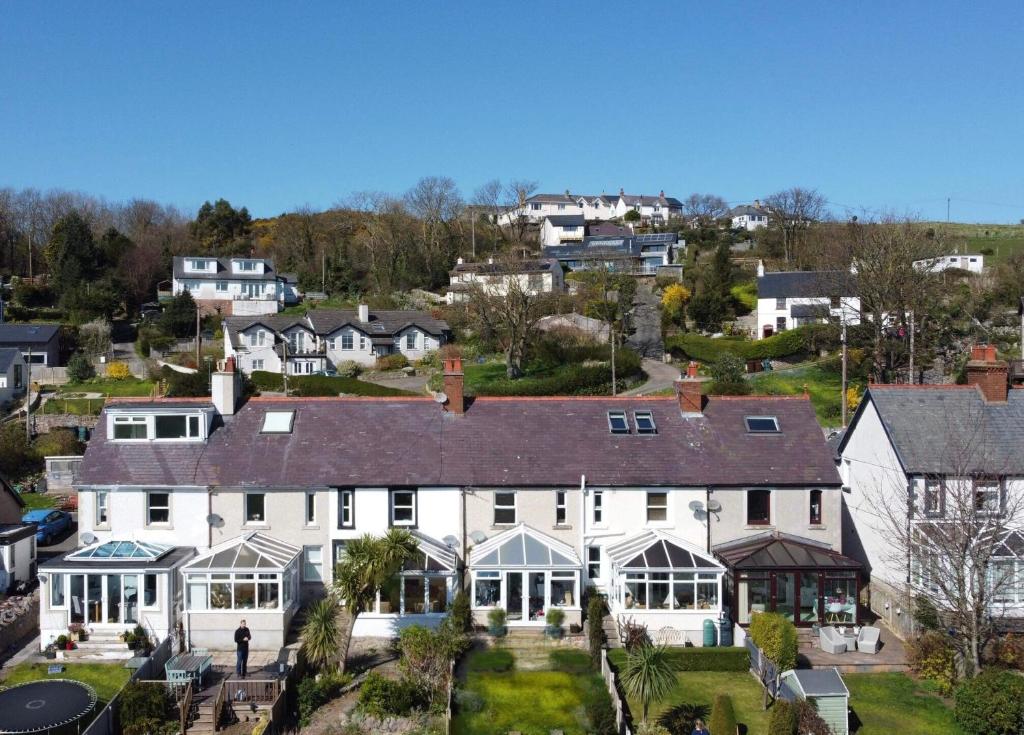 an aerial view of a large white house at Llandudno Boutique style seaside retreat with stunning views in Llandrillo-yn-Rhôs