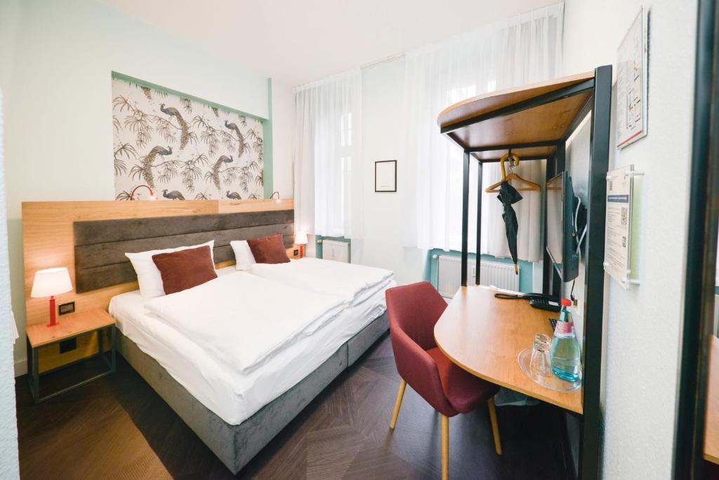 Postel nebo postele na pokoji v ubytování AMC Hotel - Schöneberg