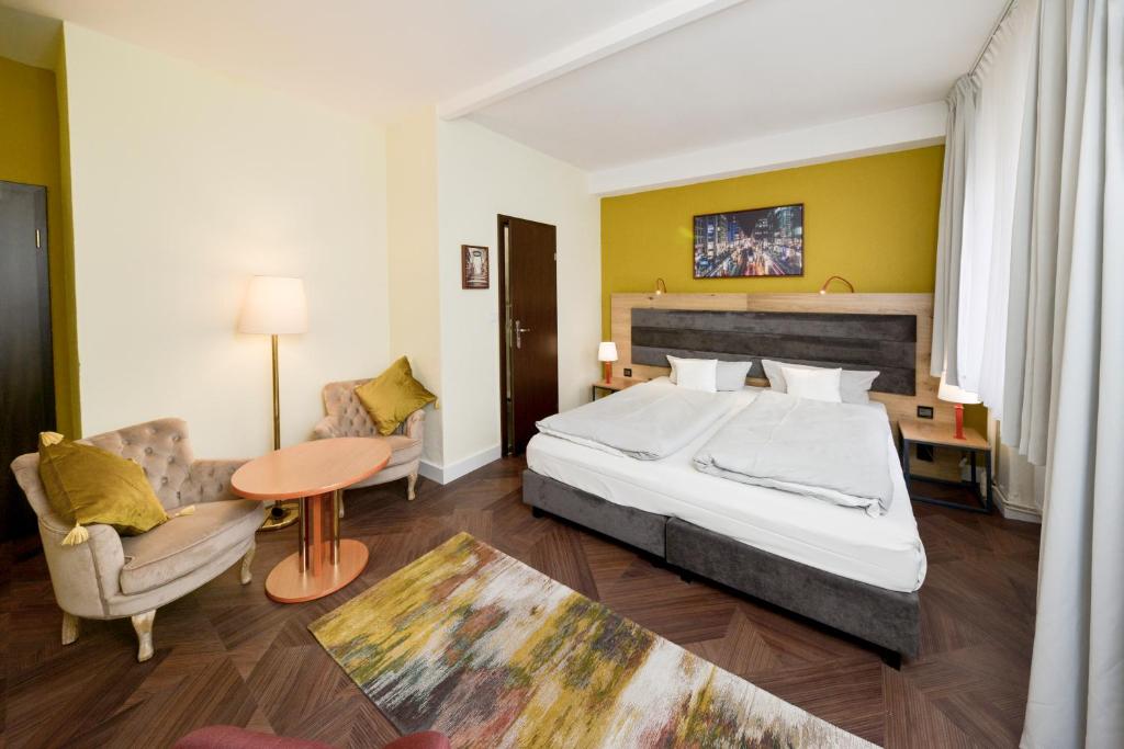 Postel nebo postele na pokoji v ubytování AMC Hotel - Schöneberg