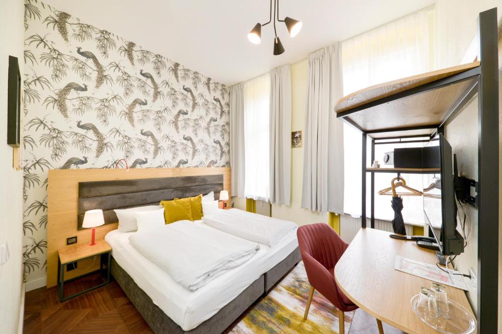 Postel nebo postele na pokoji v ubytování AMC Hotel - Schöneberg