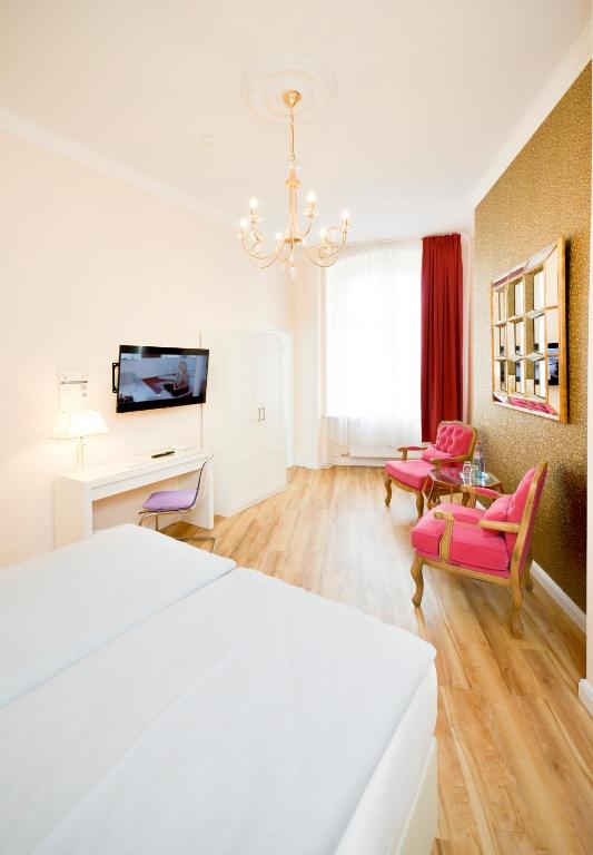 Postel nebo postele na pokoji v ubytování AMC Hotel - Schöneberg