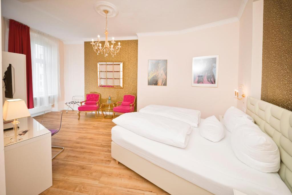 Postel nebo postele na pokoji v ubytování AMC Hotel - Schöneberg