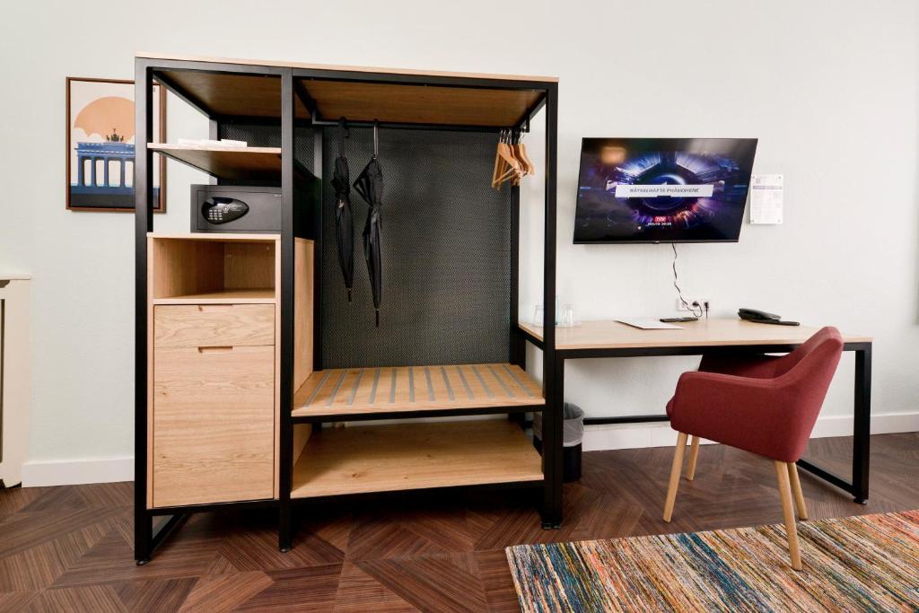 TV a/nebo společenská místnost v ubytování AMC Hotel - Schöneberg