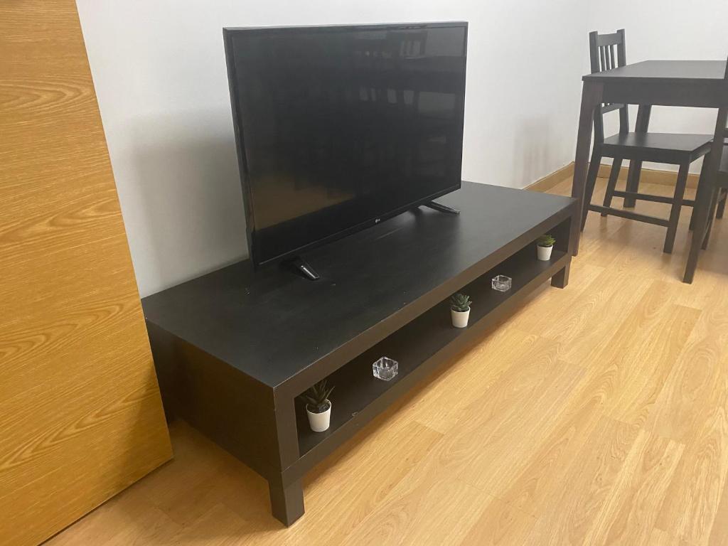 TV a/nebo společenská místnost v ubytování Plaza Mercado