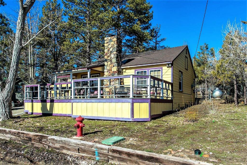a house with a fire hydrant in front of it at Frank's Old Bear-149 by Big Bear Vacations in Big Bear Lake