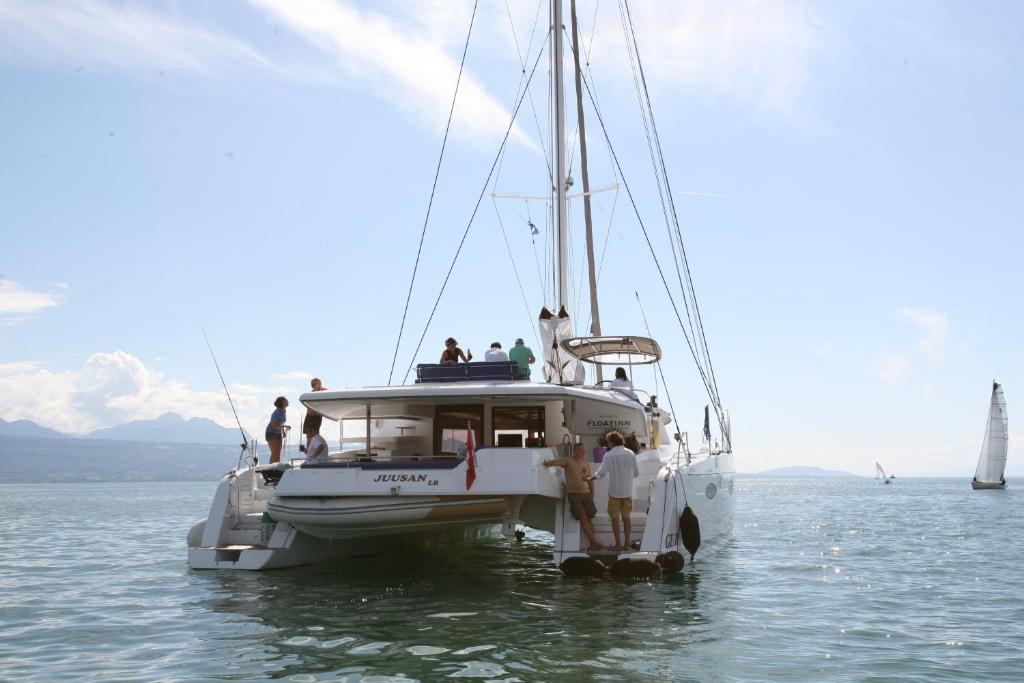 a group of people on a boat in the water at Floatinn Boat-BnB in Geneva