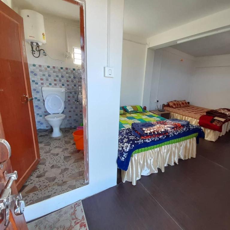 Postel nebo postele na pokoji v ubytování Jasmine Homestay Darjeeling