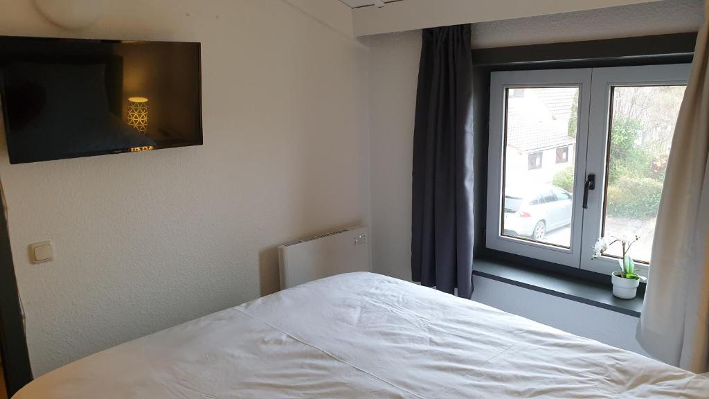 Postel nebo postele na pokoji v ubytování Vakantie appartement BePinay15