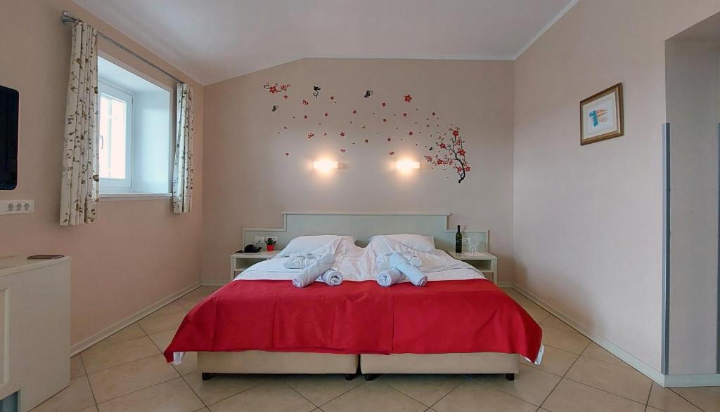 Postel nebo postele na pokoji v ubytování Hotel Kozana