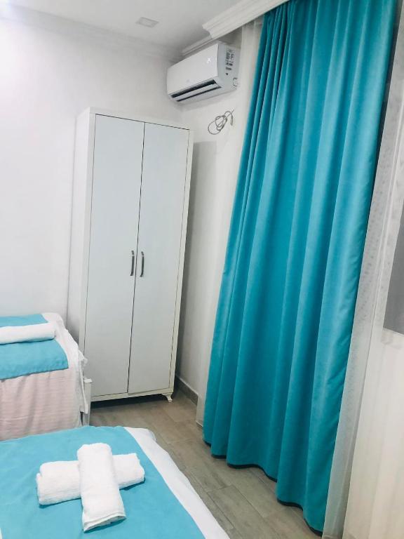 Postel nebo postele na pokoji v ubytování Nikas Guest House