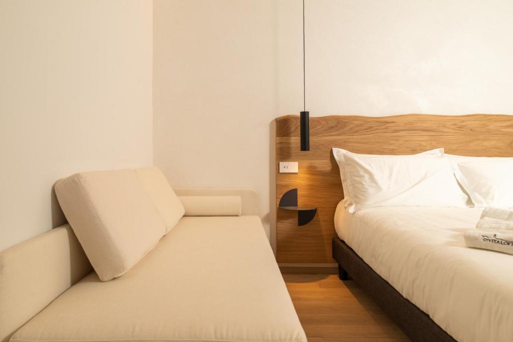 Postel nebo postele na pokoji v ubytování Civitaloft Luxury Rooms