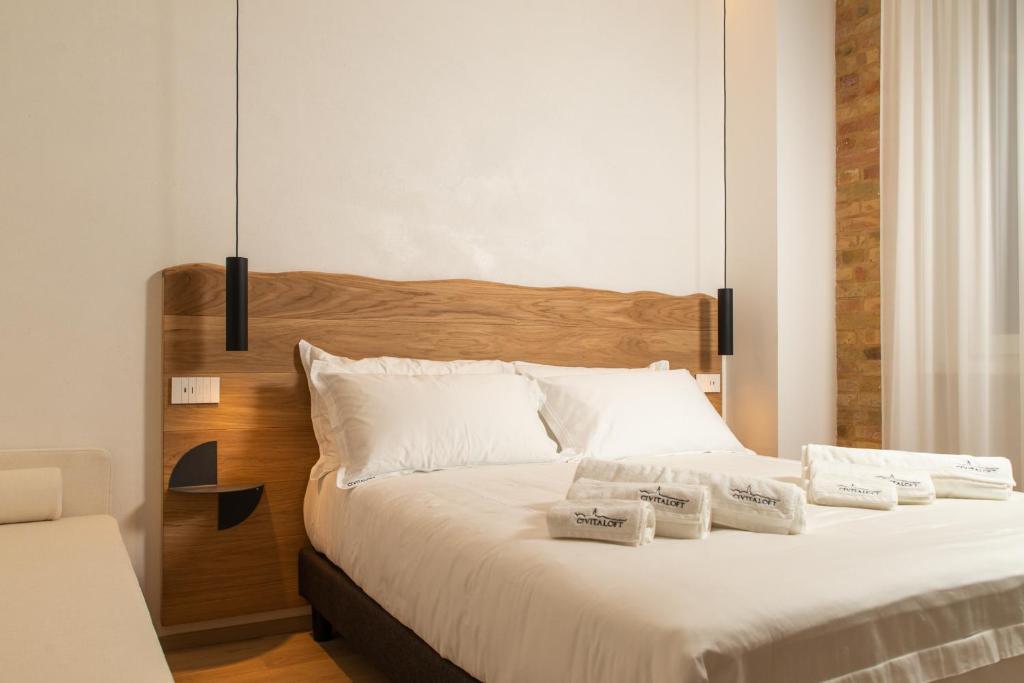 Postel nebo postele na pokoji v ubytování Civitaloft Luxury Rooms