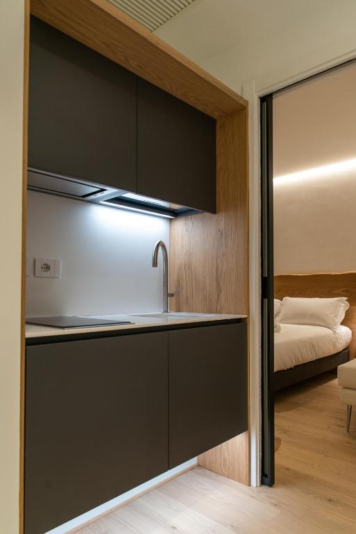 Postel nebo postele na pokoji v ubytování Civitaloft Luxury Rooms