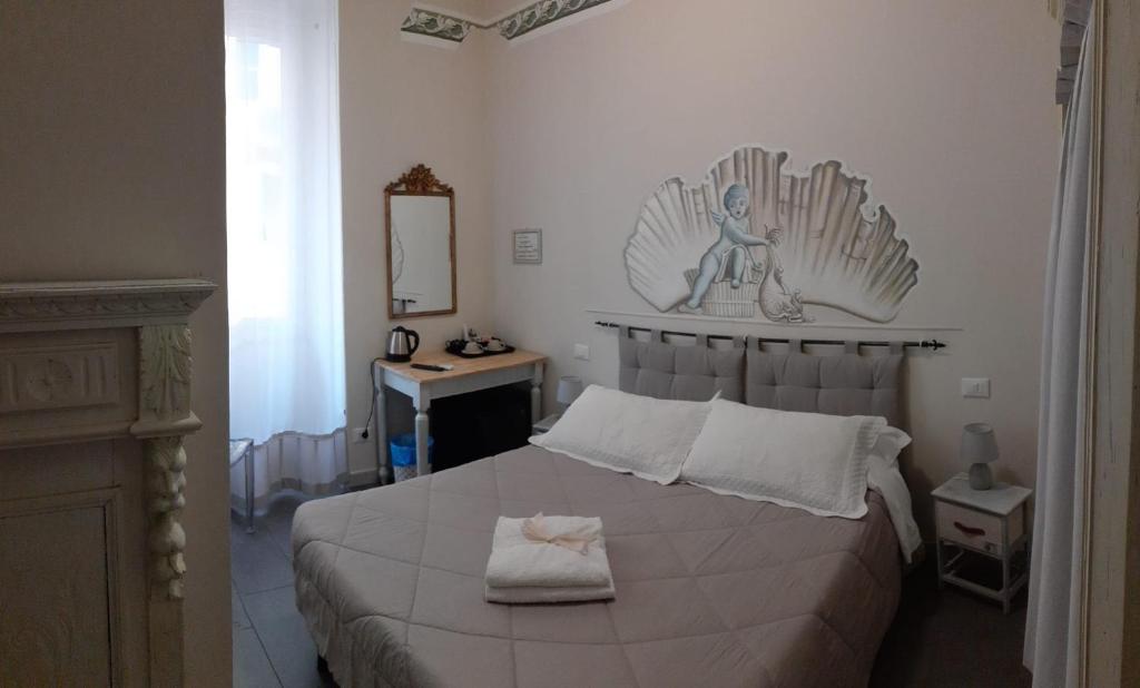 Postel nebo postele na pokoji v ubytování L'Angelo Blu