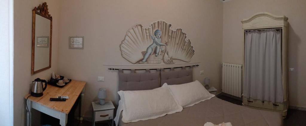 Postel nebo postele na pokoji v ubytování L'Angelo Blu