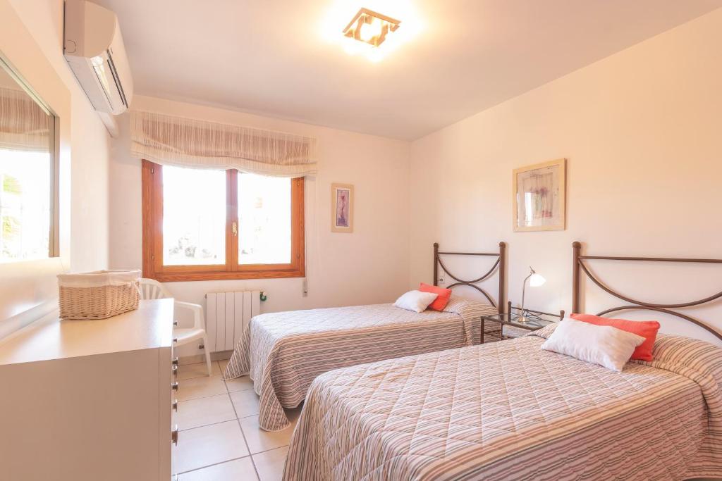 Postel nebo postele na pokoji v ubytování Villa Ana Sofía Costa CarpeDiem