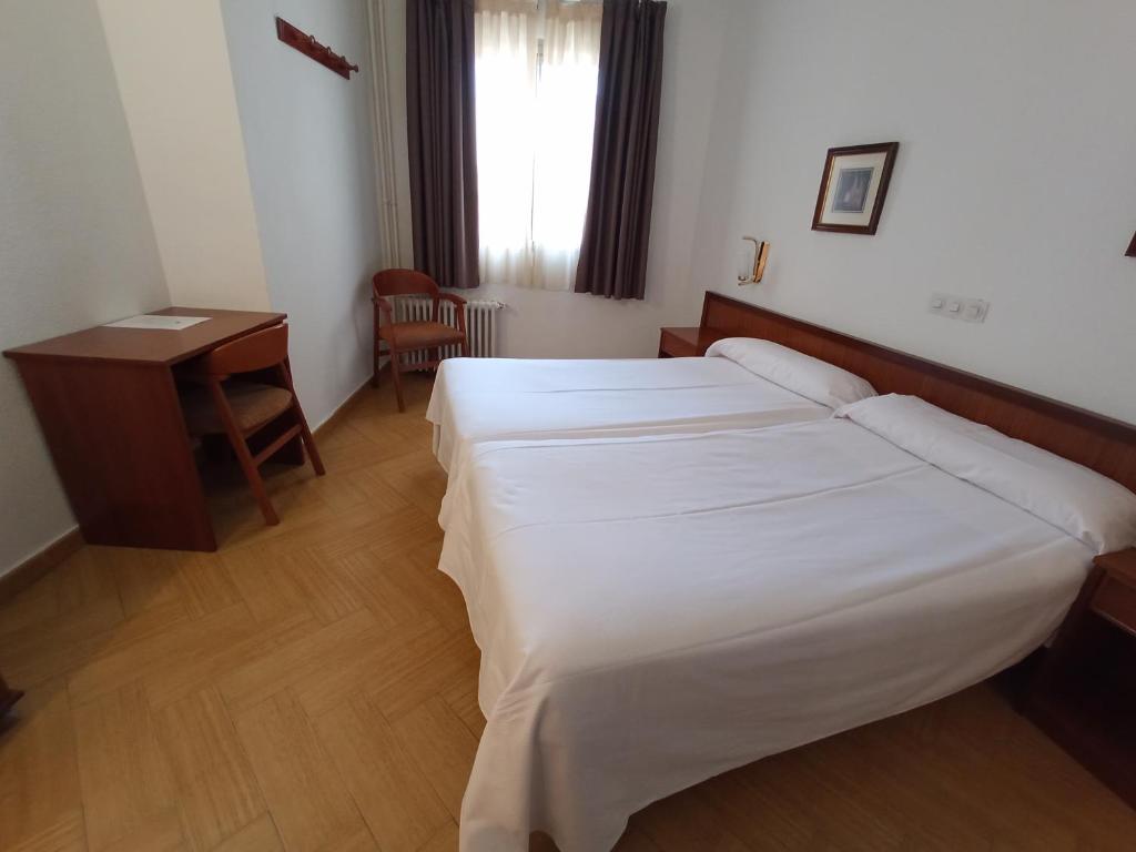 Postel nebo postele na pokoji v ubytování Hotel ELE Acueducto