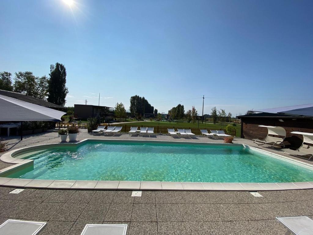 The swimming pool at or near Attractive cottage in Savigliano with a view of the lake