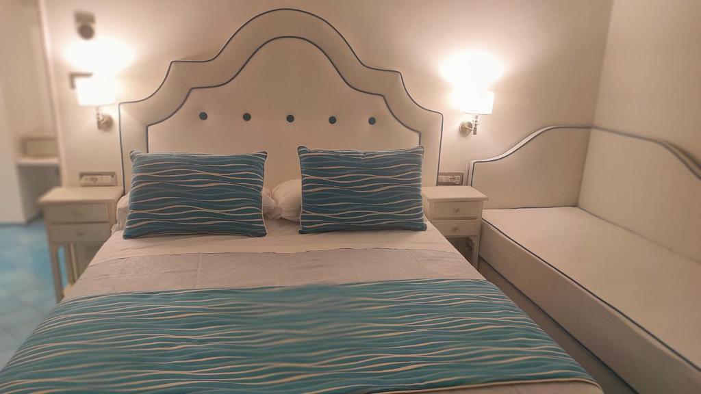 Postel nebo postele na pokoji v ubytování Albergo S. Andrea