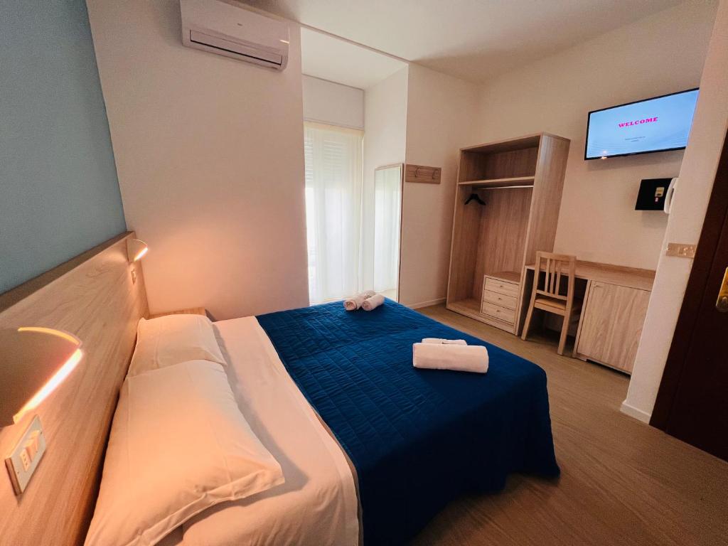 Postel nebo postele na pokoji v ubytování Hotel Damma's, Dipendenza Zamagna