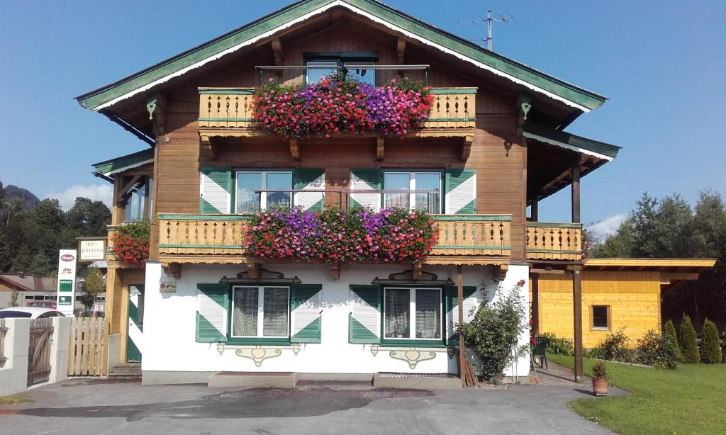 a house with flower boxes on the side of it at Apartement Haus Johanna in Kitzbühel