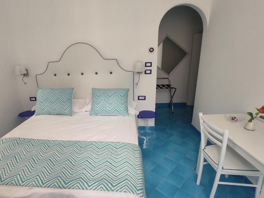 Postel nebo postele na pokoji v ubytování Albergo S. Andrea