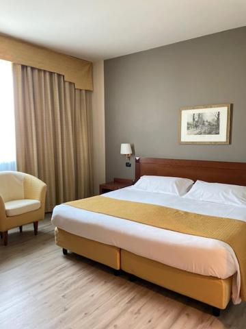 Katil atau katil-katil dalam bilik di Hotel Cavalieri