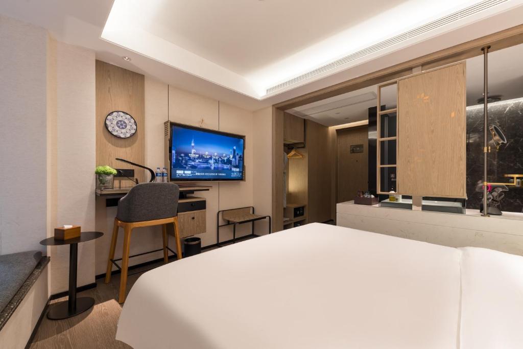 TV a/nebo společenská místnost v ubytování Paco Hotel Canton Tower Pazhou