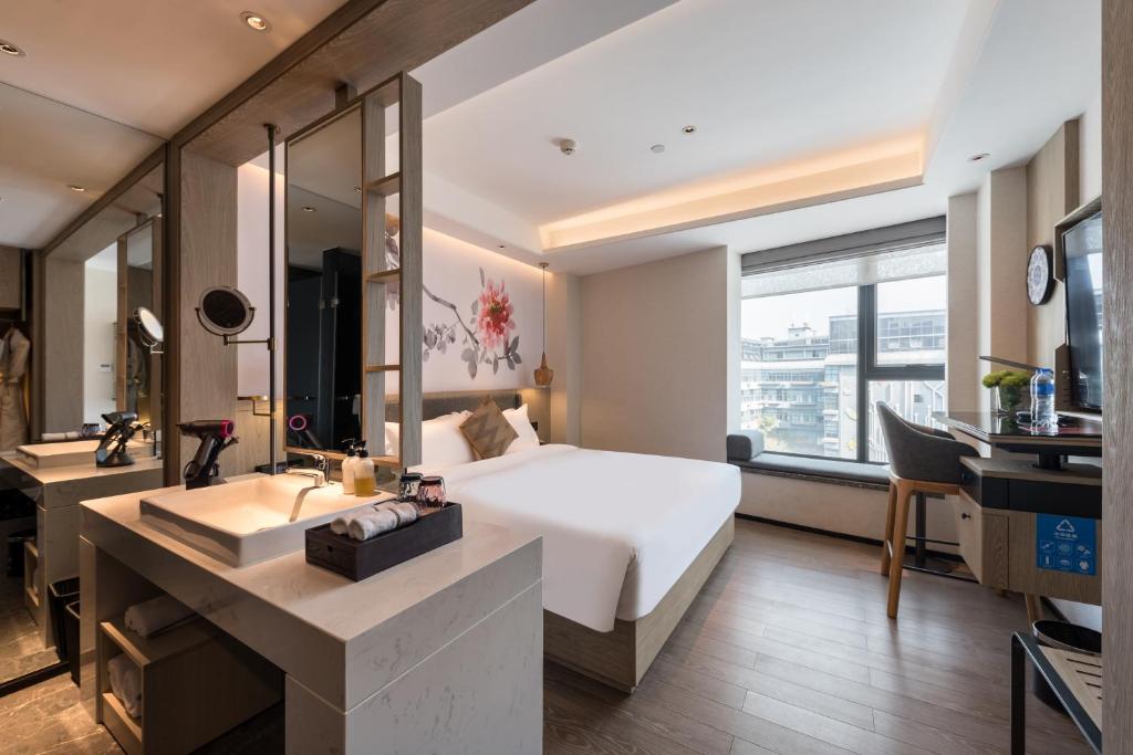 TV a/nebo společenská místnost v ubytování Paco Hotel Canton Tower Pazhou