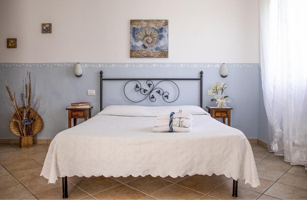 Postel nebo postele na pokoji v ubytování Agriturismo I Tre Fossi