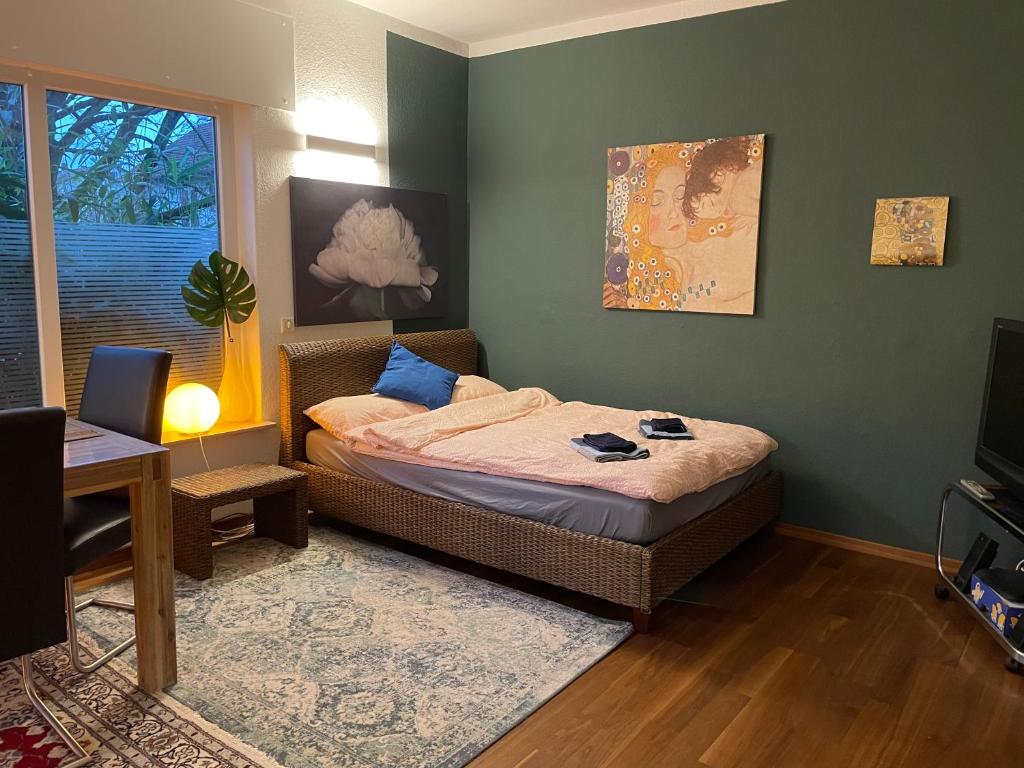 a small bedroom with a bed and a window at Großes, helles Apartement - Nähe Marburg & Gießen in Fronhausen